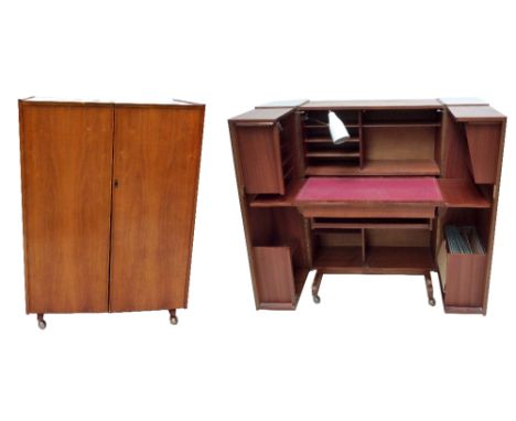A 1960s/70s walnut compactum desk, the twin front cupboard doors enclosing file drawers, leather writing surface, various she
