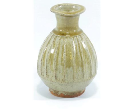 JIM MALONE (born 1946); a small fluted stoneware bottle covered in green ash glaze, impressed JM and A mark for Ainstable, he