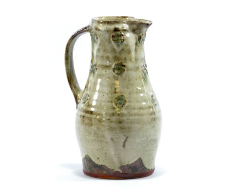 JIM MALONE (born 1946); a stoneware jug, white slip over tenmoku ground, impressed JM and A for Ainstable marks, height 27cm.