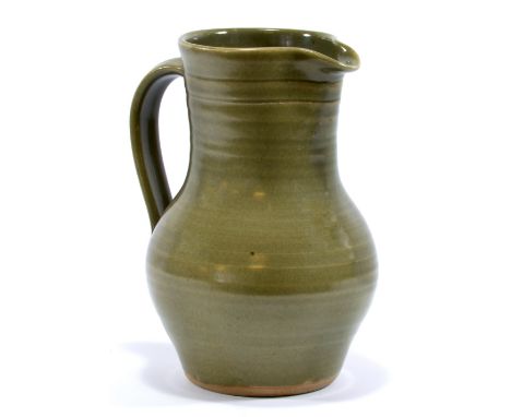 LEACH POTTERY; a stoneware lemonade jug covered in green glaze, impressed SI mark, height 24.5cm.   CONDITION REPORT:  Glazes