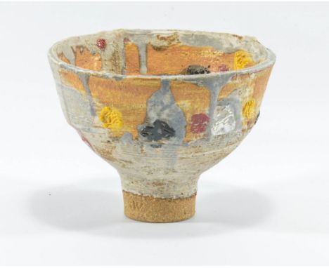 ROBIN WELCH (born 1936); a small stoneware pedestal bowl decorated with patchy matt grey glaze and enamel spots, impressed RW