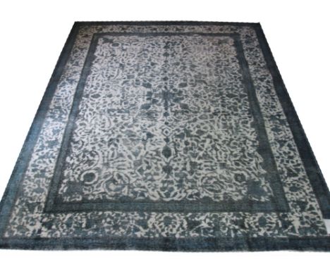 VINTAGE KERMAN CARPET, 370cm x 300cm, of an ivory field and lapis scrolling vines.