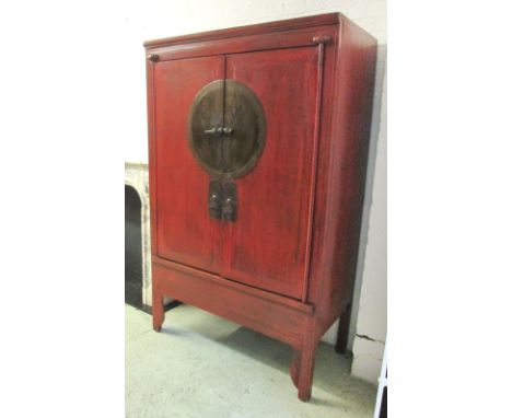 CHINESE WEDDING CABINET, red lacquered with a pair of panelled cupboard doors enclosing a shelf and two drawers, 116cm W x 18