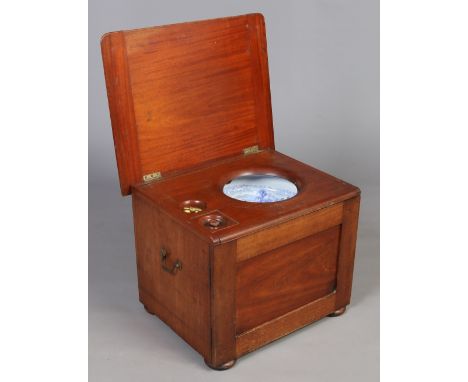 A Victorian mahogany commode with flushing mechanism and original blue and white pottery liner J. W. & S. Crescent London, 63