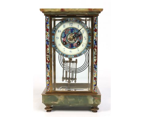A 19th century French four glass mantel clock. With onyx plinth and pediment, adorned with champleve enamel bands and having 