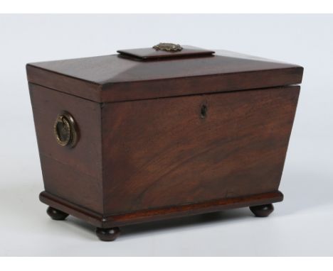 A Victorian mahogany tea caddy of sarcophagus form raised on squat bun feet, 23cm wide.  Condition Report. To be used as a gu