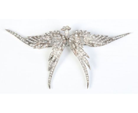 A vintage white metal costume jewellery brooch formed as a pair of wings and set with white paste stones, 10.5cm wide.  Condi
