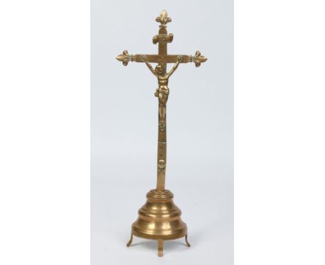 A 19th century French bronze corpus Christi raised on a stepped demi lune plinth, 31cm.  Condition Report. To be used as a gu