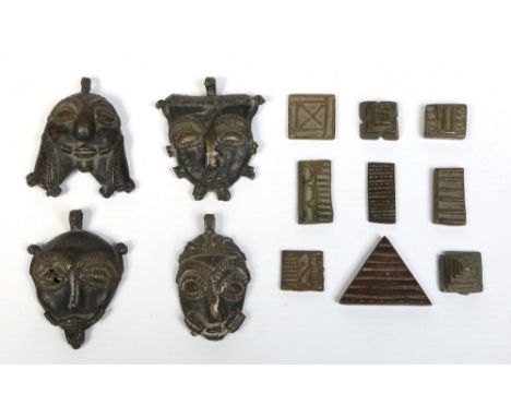 Four Benin bronze small masks and nine tokens / weights. Largest mask 5.5cm.  Condition Report. To be used as a guide only. G