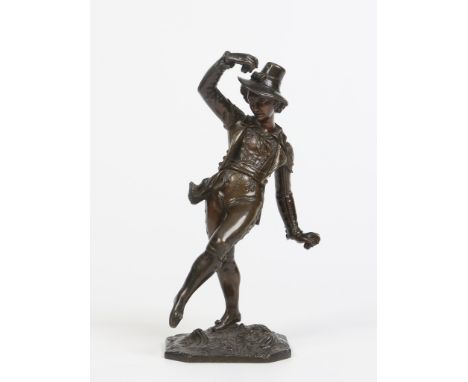 A 19th century Continental patinated bronze figure of a dancing man playing castanets. Raised on a naturalistic square canted