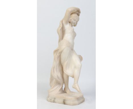A late 19th century carved white marble statue of a dancing gypsy girl raised on a canted plinth, 61cm. Condition Report. To 