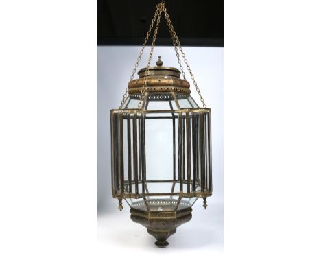 A large Islamic brass and panelled glass temple lantern, 80cm.  Condition Report. To be used as a guide only. Wear and discol