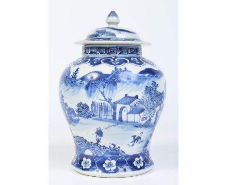 A 19th century Chinese baluster ginger jar and associated cover. Painted in underglaze blue with a landscape between a ruyi b