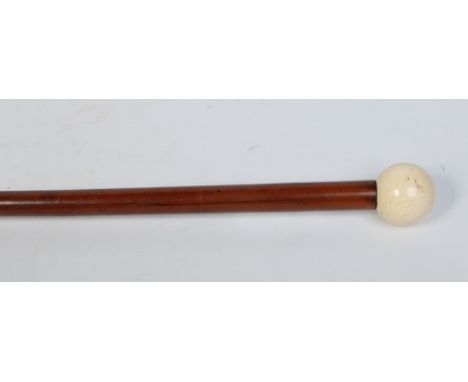 A Victorian malacca walking cane with turned spherical ivory grip, 87.5cm.  Condition Report. To be used as a guide only. Lig