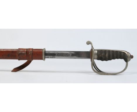 A George V Royal Artillery Officers sword in leather mounted scabbard. With shagreen grip and etched blade inscribed John Bla