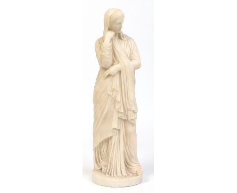 A 19th century small carved white marble statue of a Grecian maiden dressed in flowing robes and raised on a textured circula