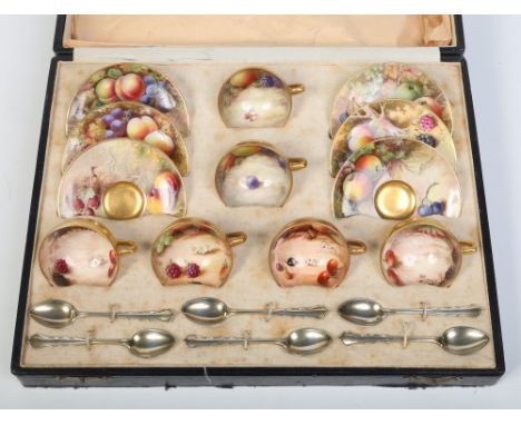 A cased Royal Worcester six place coffee set. Comprising of six coffee cups and saucers and six silver gilt coffee spoons. Gi