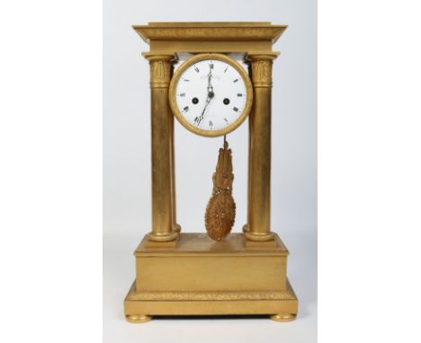 A large early 19th century French gilt bronze portico clock. With enamel dial having Roman numeral markers and signed Gabriel