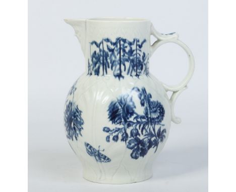 A Worcester cabbage leaf moulded mask jug. With scrolling openwork handle and printed with the Natural Sprays Group pattern. 