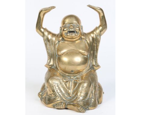 A Chinese polished bronze figure of a Buddha seated with his arms raised and decorated with Buddhistic symbols to his robes, 