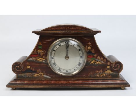 An Edwardian carved mahogany thirty hour mantel clock with chinoiserie decoration. Having silvered dial with Roman numeral ma