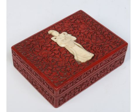 A 19th century Chinese cinnabar lacquer box and cover with four compartments. Set to the top with a carved ivory portrait of 