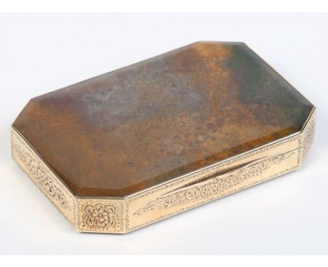 A gold mounted moss agate snuff box of canted rectangular form, engraved to the sides with scrolls and flower heads. Unmarked