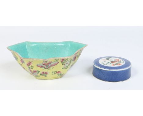 A 19th century Chinese serpentine shaped bough pot. Yellow ground, with incised decoration and painted in famille rose enamel