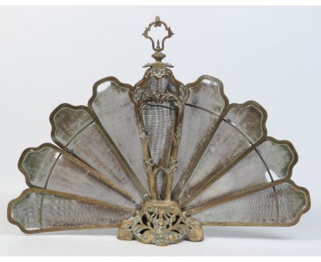 A Regency brass and mesh fan shaped folding fireguard, 59.5cm high, 79cm wide.  Condition Report. To be used as a guide only.