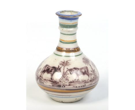 An 18th century Maiolica bottle flask. Decorated with a puce monochrome continuing landscape incorporating cattle, and hares 