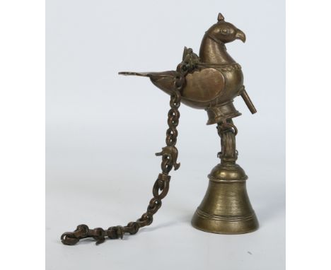 A 19th century Indian hanging bronze bell supported on a chain and formed as a bird, 29cm excluding the chain.  Condition Rep