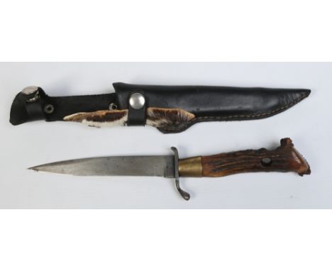 A German hunting knife with antler handle and in associated leather sheath. Blade stamped E. R. N. Wald Rheinl, Rasiermesser 