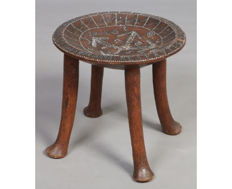 An African carved hardwood dish top stool with piquet inlay inscribed R. W. Hemisted, Arok Masa Reserve, 41cm diameter. Condi
