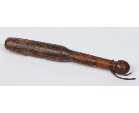 A 19th century primitive turned hardwood tipstaff, 24.5cm. Condition Report. To be used as a guide only. Heavy use but free f
