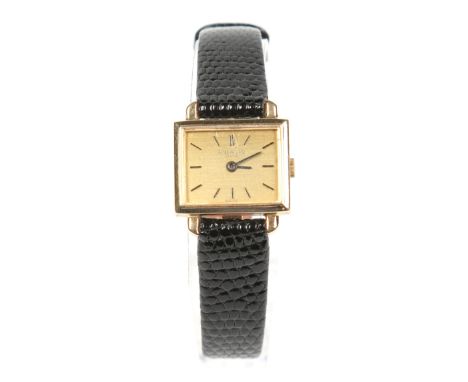 A ladies 1960s 18 carat gold cased Patek Philippe manual wristwatch. With fixed lugs and a rectangular satin gold dial having
