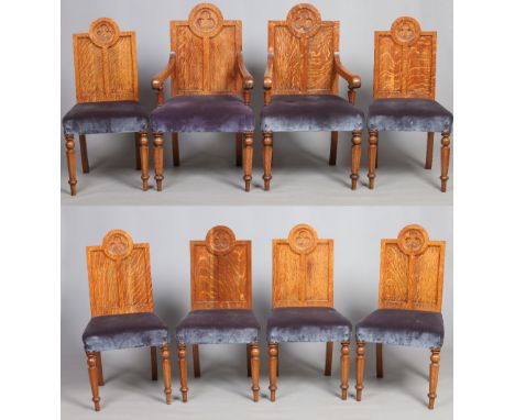 A set of eight Puginistic light oak dining chairs with panelled trefoil backrests and including a pair of carver armchairs. C