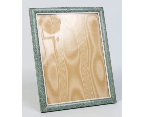 An early 20th century large shagreen easel photograph frame with ivory fillet, watered silk backing and lacquered brass strut