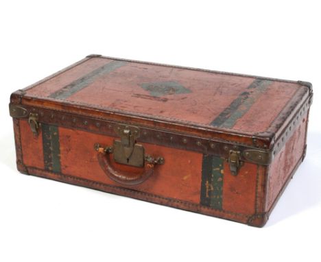 A vintage Louis Vuitton leather mounted suitcase. With brass studs and clasps stamped Louis Vuitton. Paper label inside numbe