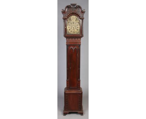 A mahogany longcase clock of small proportions by Maple & Co. London. With swan neck pediment, blind fret carving, Corinthian