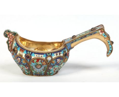 A Russian silver gilt Kovsh with lobed bowl and having enamelled and jeweled decoration. Punch marks for Moscow 1873, 14cm. C