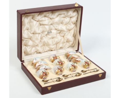 A cased Royal Worcester six place coffee set by James Stinton retailed by Harrods of London. Each cup and saucer enamelled wi