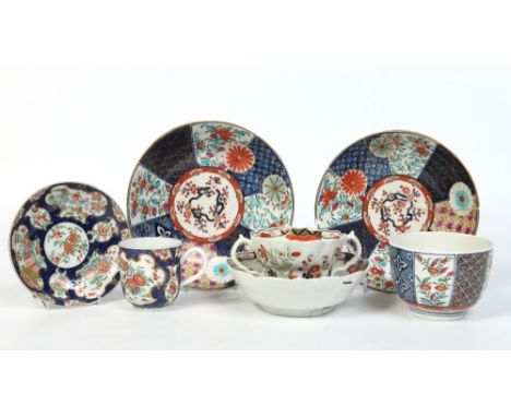 Seven pieces of Worcester decorated in the Imari palette. Comprising of two saucer dishes and a sugar bowl painted in the bro