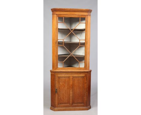 A Victorian light oak corner cupboard with astrigal glazed top and panelled cupboard base, 194cm. Condition Report. To be use