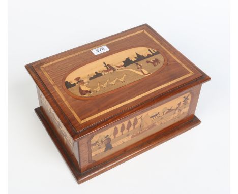 An Isle of Man First World War Remembrance marquetry inlaid work box. Decorated to the outside with panels of figures. The in