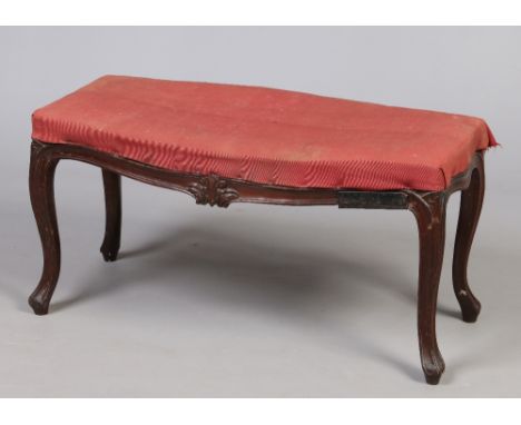 A Georgian Hepplewhite carved mahogany stool. With overstuffed seat and raised on scrolling supports. Brass plaque for W. Wil