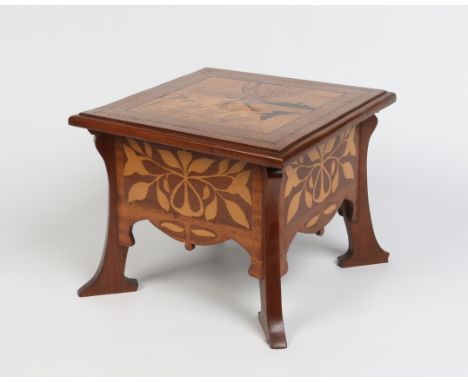 In the manner of Louis Marjorelle. An Art Nouveau mahogany stool with a marquetry panel to the top depicting children and dec