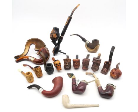 A collection of smoker's pipes, to include a cased example with London silver collar and amber stem, a clay pipe by P. McLach