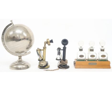 A lot comprising a 20th century brass "conversation pieces" candlestick rotary telephone, another candlestick rotary telephon