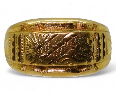 A bright yellow metal dome ring with engraved detail, stamped with Chinese characters 96.9%, finger size gents size Z+1 1/2, 