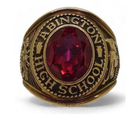 A 10k Jostens brand American college ring, for Abington High School 1966 Galloping Ghosts, set with a red glass gem, size T, 